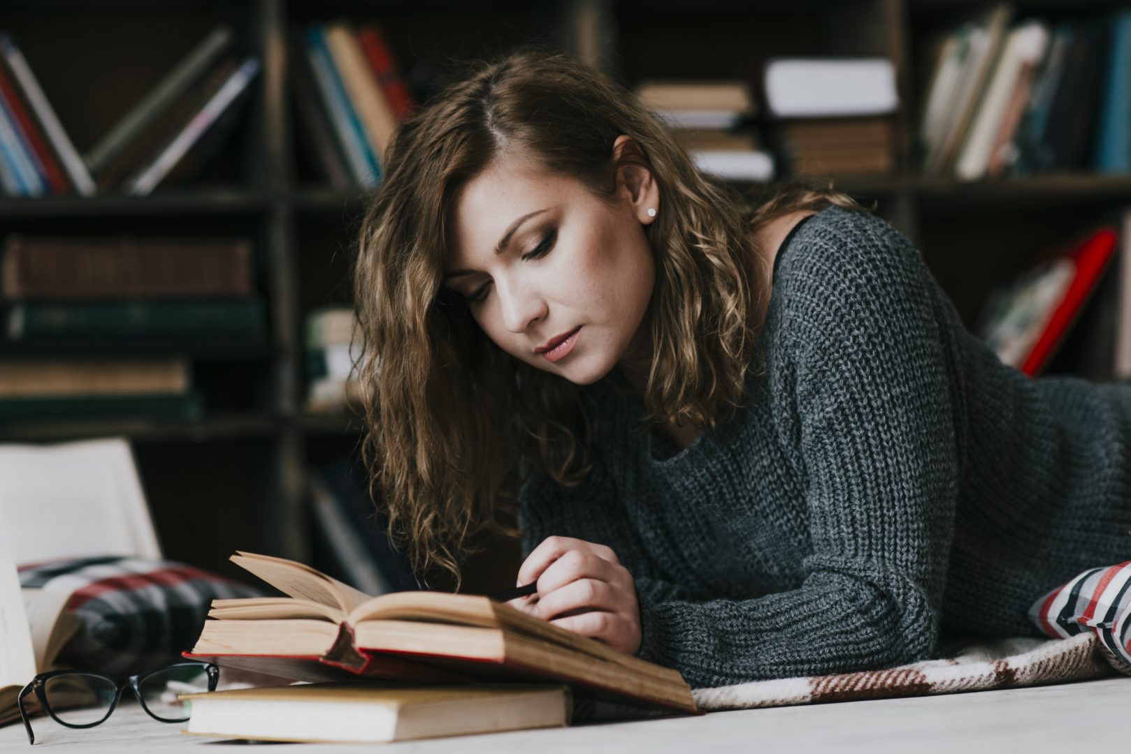woman-reading-book-floor
